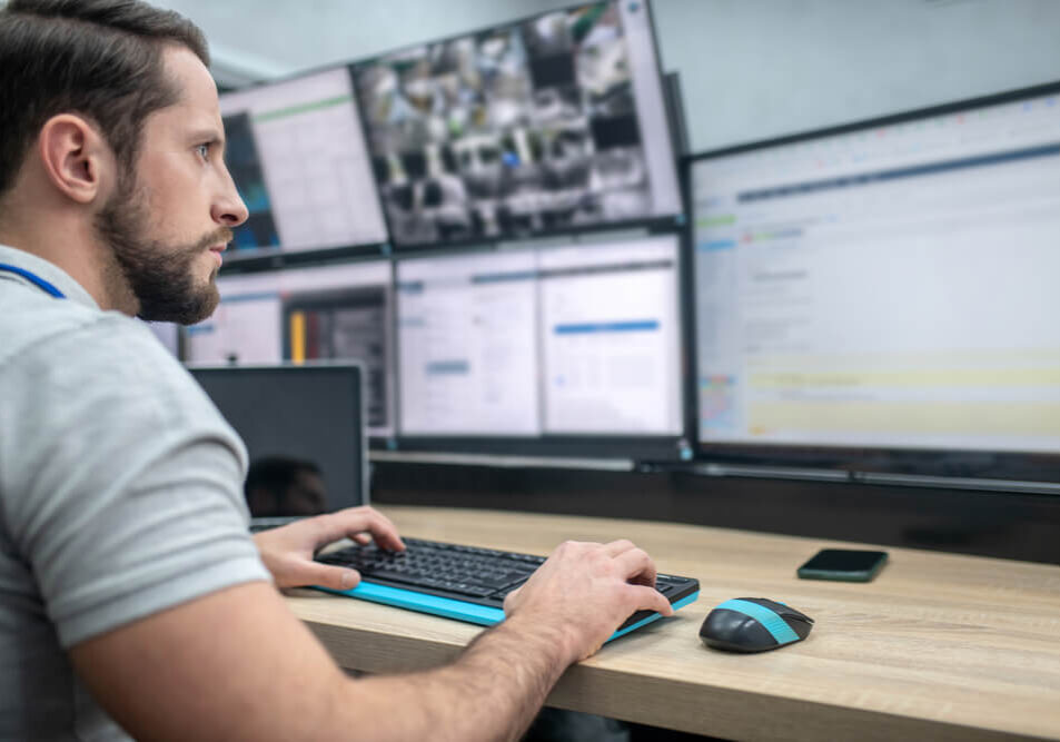A man using AngelTrack in a dispatch center